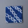 Dessous de verre Zharan — Rosaces terre cuite Dessous de verre en coton indigo et terre cuite au motif de rosaces